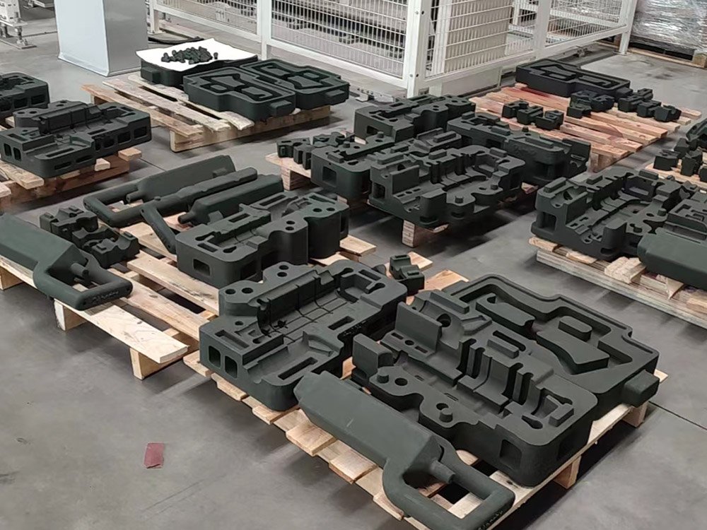 3D printed sand moulds on pallets at the works